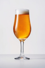 A glass of beer with foam in a white background