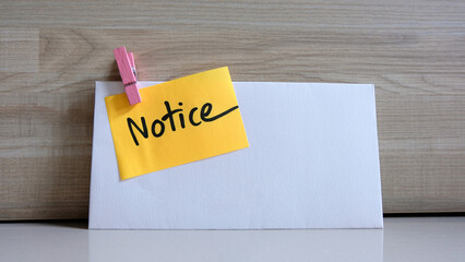 Notice message concept written post it on envelope.