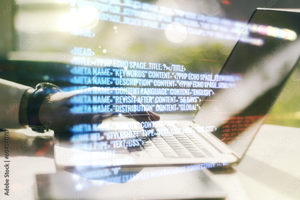 Fototapete multi exposure of abstract programming language hologram with hands typing on computer keyboard on b