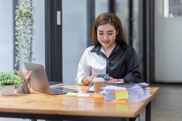 Young asian woman, professional entrepreneur standing and call phone in office clothing, smiling and looking confident, workplace background
