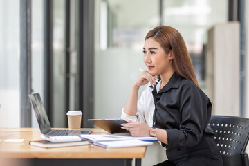 Obraz premium Business Asian woman working at office with documents on his desk, doing planning analyzing the financial report, business plan investment, finance analysis concept 