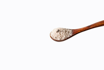 Wooden spoon with truffle seasoned salt,white background.