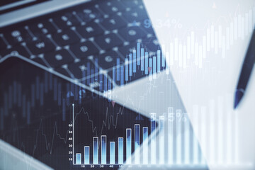 Multi exposure of abstract financial graph on laptop background, financial and trading concept