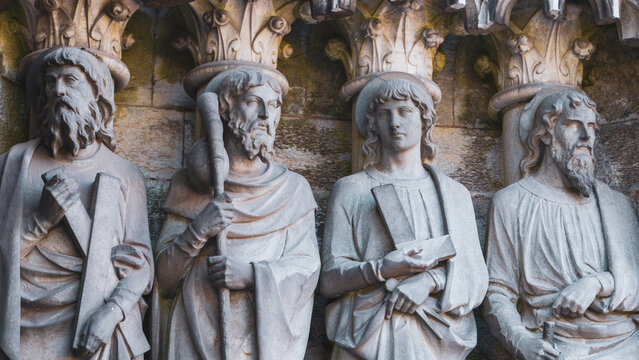 Sculptural images of the Holy Apostles on the facade of Saint Fin Barre's Cathedral in Cork, Ireland. The Apostles Andrew, James major, Thomas, Matthias.