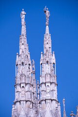 Daytime view of famous Milan Cathedral (Duomo di Milano) on piazza in Milan, Italy