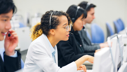 Multinational operator group working in the office. Call center. Customer support staff.