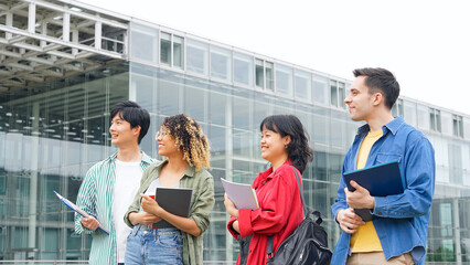Group of multinational young people smiling in college campus.