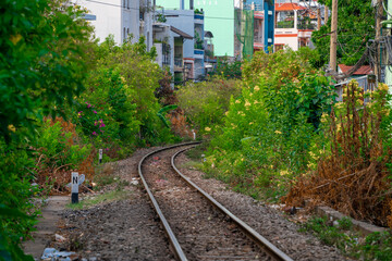 Naklejka premium Incredible view of train passing through a narrow street, the Hanoi Old Quarter. Stock photo