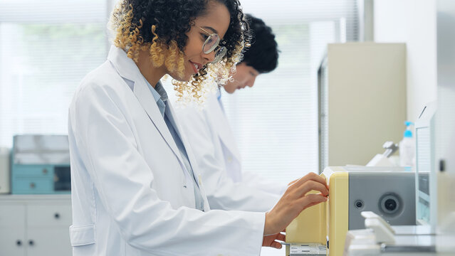 Group of researcher using experimental equipment.