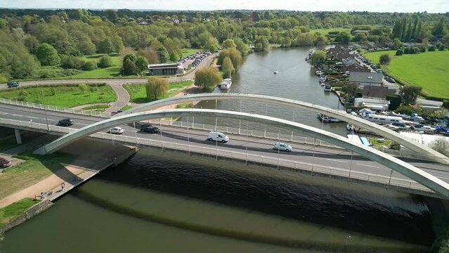 The drone aerial footage of Walton bridge across the Thames River, England, UK. Walton Bridge is a road bridge across the River, carrying the A244 between Walton-on-Thames and Shepperton. 