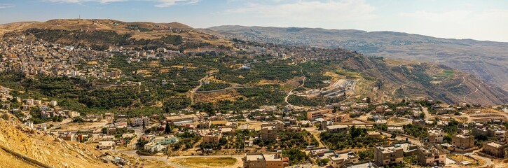 Fototapeta na wymiar Panorama of Al- tafilah city and danna mountains- afra hot water مدينة الطفيلة وجبال محمية ضانا الرائعة وبحيرة لوط عليه السلام