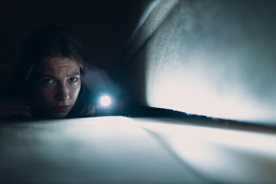 Woman Young Holding Hand Flashlight Looking For Dirt Under Furniture