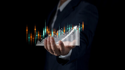 Businessman hand of or trader touches showing growing virtual holographic stocks. Planning & Strategy Stock Market Business Growth progress or success invest in trading.