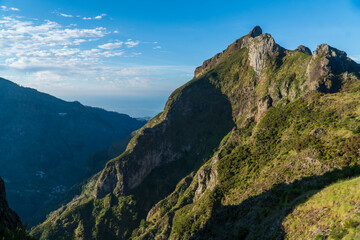 Fototapeta na wymiar Panoramic mountains view from pico do jorge pico grande viewpoint down to Curral das Freiras through the Nun's Valley on Madeira Island