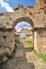 Fototapeta na wymiar Roman arch construction at the gates of the Roman city of Cuicul, Algeria