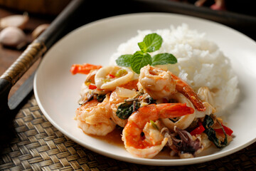 Thai food, stir-fried basil, stir-fried basil with shrimp and squid, popular Thai food. popular Thai food concept, spicy food