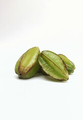 Closeup of Carambola or Star Fruit Isolated on White Background with Copy Space in Vertical Orientation