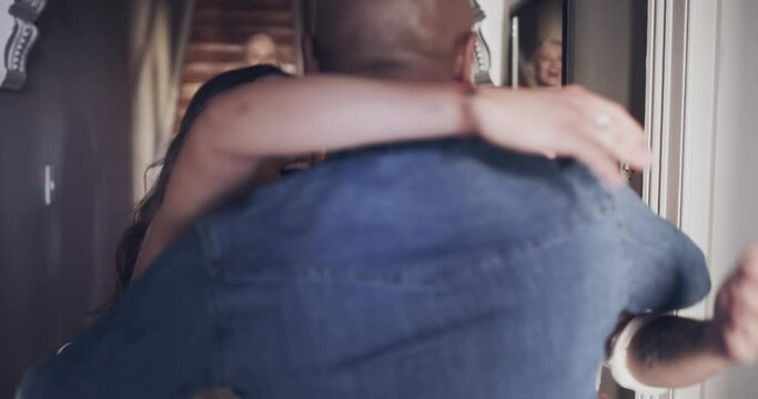 Friends, home reunion and people welcome, hug and return celebration, visit or man in diverse house. Surprise, group and excited to celebrate, love or greeting with joy, happiness and care for person