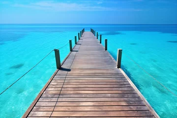  wooden pier on the tropical ocean, maldives  © Kodjovi