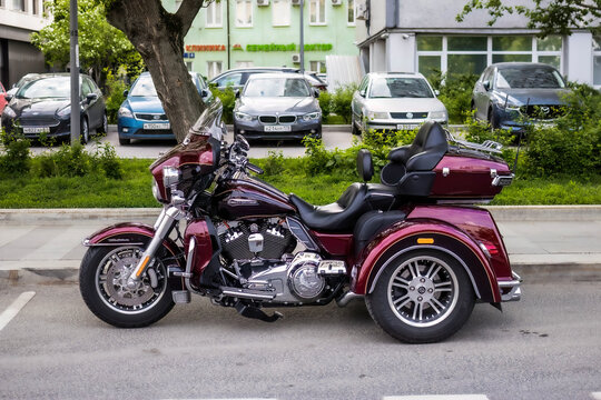Harley-Davidson Trike Motorcycle parked on street, side view