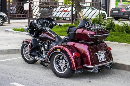 Harley-Davidson Trike Motorcycle parked on street, rear side view
