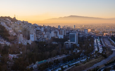 Aerial view of skyline and cityscape of historical city of Shiraz at sunrise, Shiraz, Fars Province, Iran, known as City of Love and Literature.