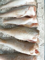 Raw fish fillets on a white background. Close-up.