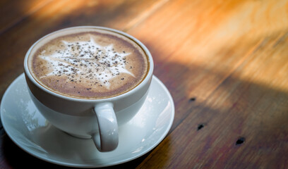 A coffee on the wood table background.