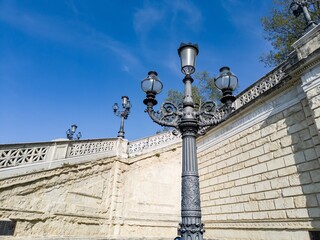 Black street lamp near Fontana della Ninfa e del Cavallo Marino in Bologna, Italy