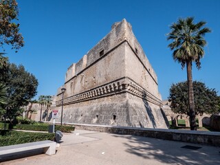 Fototapeta na wymiar Castello Svevo di Bari castle in Bari, Italy with palm trees and moat