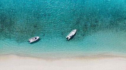 Aerial view with sand beach  as seashore with the tropical island in a coral reef ,blue and turquoise sea  background © SASITHORN