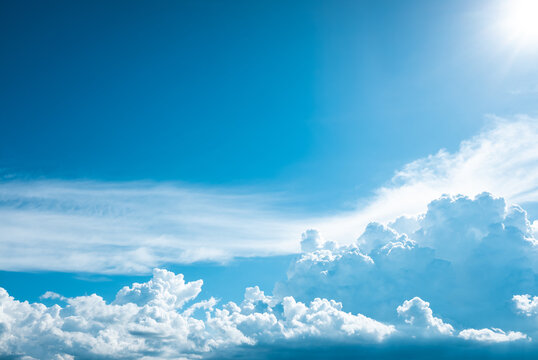 Beautiful blue clear sky with white cloud and sunshine background.