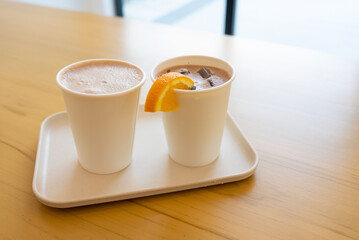 Two Cups of Iced and Hot Chocolate Served on Table in Restaurant