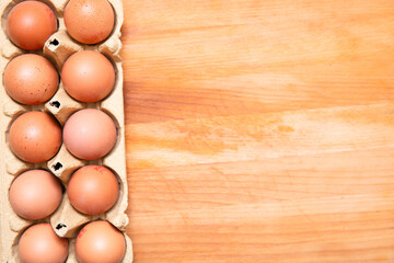 chicken eggs on a wooden background
