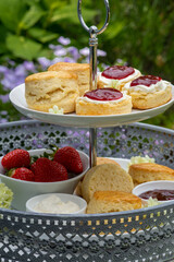 baked scones with raspberry jam and clotted cream at teatime