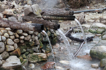 a traditional shower made of bamboo to circulate hot water containing geothermal sulfur