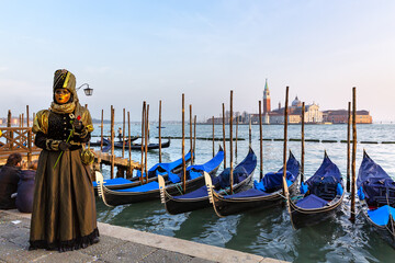 Fototapeta na wymiar Gorgeous image of carnival masks in Riva degli Schiavoni, Venice