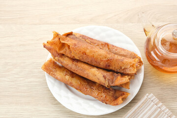 Pisang Aroma or Pisang Caramel, Indonesian traditional snack. Made of banana, chocolate and sugar wrapped in flour sheet.
