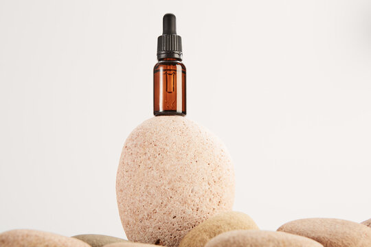 Natural medicine product in glass vial on stones.
