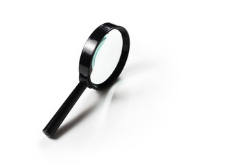 magnifying glass with black handle on white background. closeup photo side view