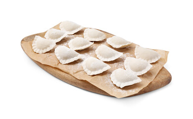 Raw dumplings (varenyky) with tasty filling and flour on white background