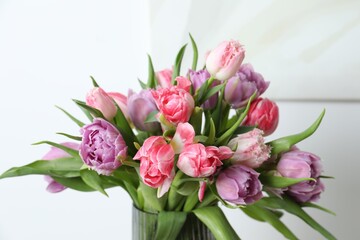 Beautiful bouquet of colorful tulip flowers on blurred background, closeup