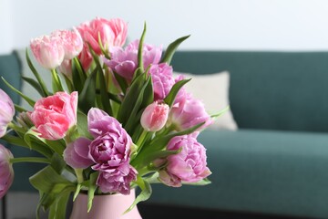 Beautiful bouquet of colorful tulip flowers indoors, closeup. Space for text