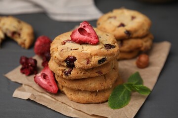 Cookies with freeze dried fruits and mint on grey table, closeup