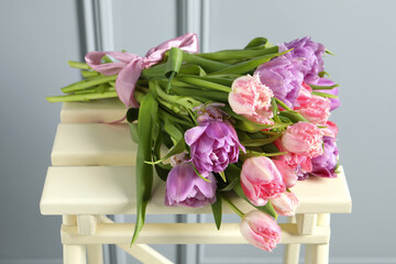 Beautiful bouquet of colorful tulip flowers on stool