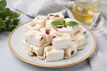 Pieces of delicious nutty nougat on light table