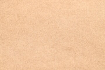 Fototapeta premium Texture of beige paper sheet as background, top view