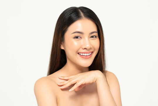 Portrait of clear skin Asian woman face in white background for beauty and skincare concept