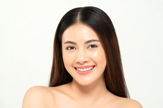 Portrait of clear skin Asian woman face in white background for beauty and skincare concept