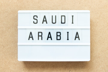 Lightbox with word saudi arabia on wood background
